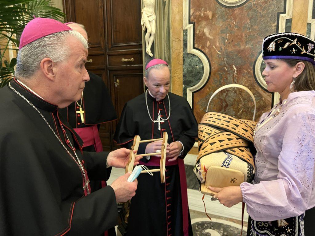 Michelle Schenandoah at the Vatican in Rome meeting with Catholic leaders. She asserted that she would be taking the cradleboard home -- upon which the Pope had meditated. (Photo: Katsitsionni Fox)